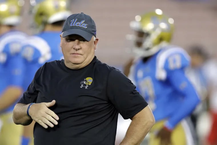 UCLA head coach Chip Kelly watches his team warm up before an NCAA college football game against Fresno State Saturday, Sept. 15, 2018, in Pasadena, Calif.