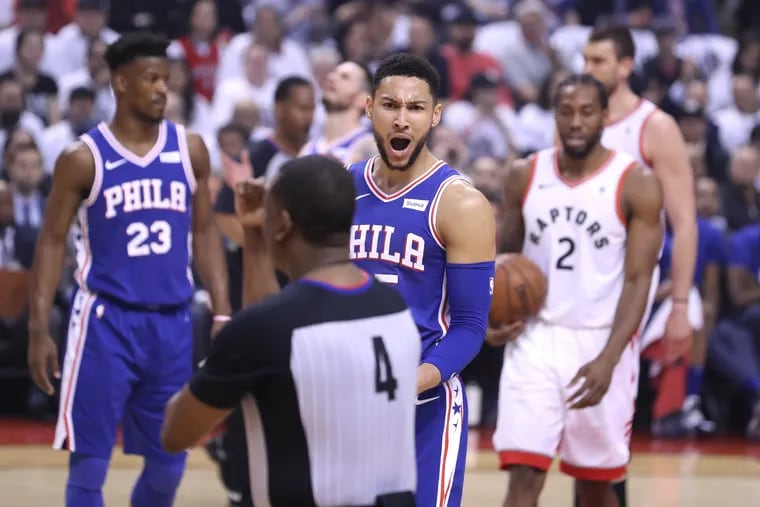 Ben Simmons, center, of the Sixers argues with an official after being called for a foul during the 1st half of their NBA Eastern Conference semifinal game at the Scotiabank Arena in Toronto on May 7, 2019.
