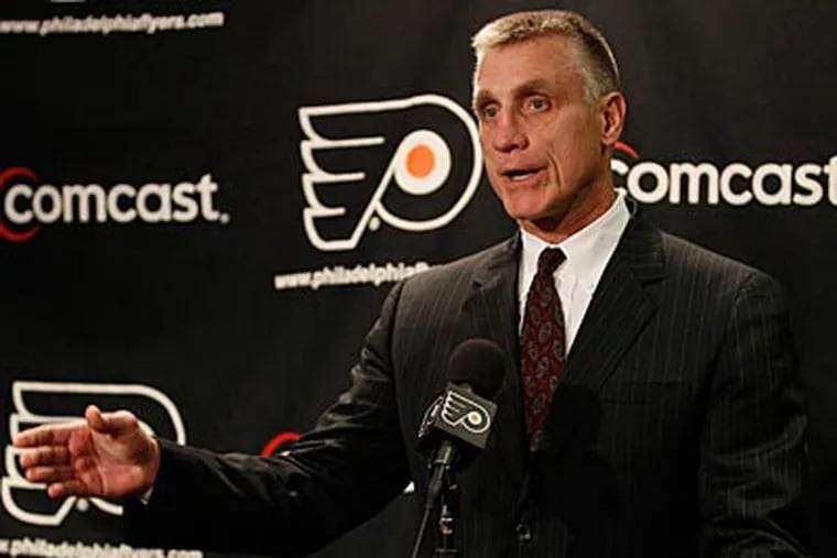 Flyers general manager Paul Holmgren said he was "happy" with his team in May. (Matt Slocum/AP)