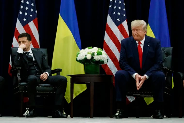 In this Wednesday, Sept. 25, 2019 file photo, President Donald Trump meets with Ukrainian President Volodymyr Zelenskiy at the InterContinental Barclay New York hotel during the United Nations General Assembly, in New York. Ukraine's president appears to be playing to both sides of the U.S. political divide, hedging his bets to ensure U.S. financial and military aid keeps flowing no matter who wins next year's election. (AP Photo/Evan Vucci, File)