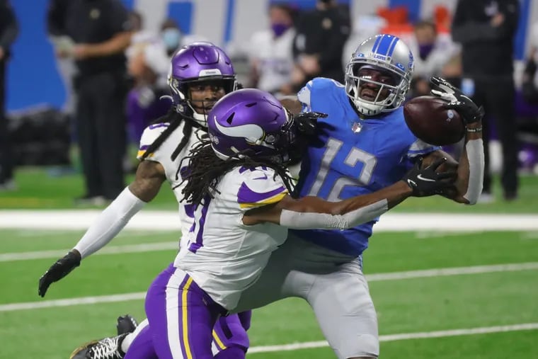 Detroit Lions receiver Mohamed Sanu couldn't complete the catch against Minnesota Vikings safety Anthony Harris during the first half Jan. 3.