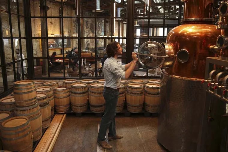 Ted Green checking on the distilling at La Colombe's Fishtown location at its 2014 opening.