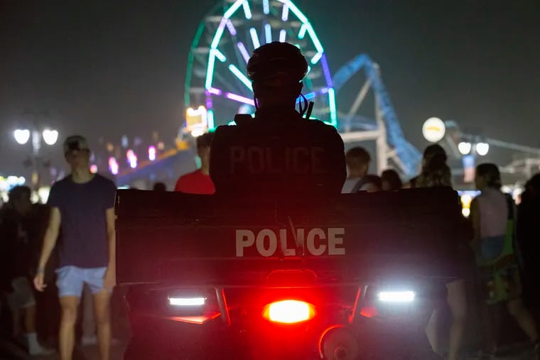Police keep an eye on large groups of teens gathered on the beach in Ocean City, N.J., in 2021.