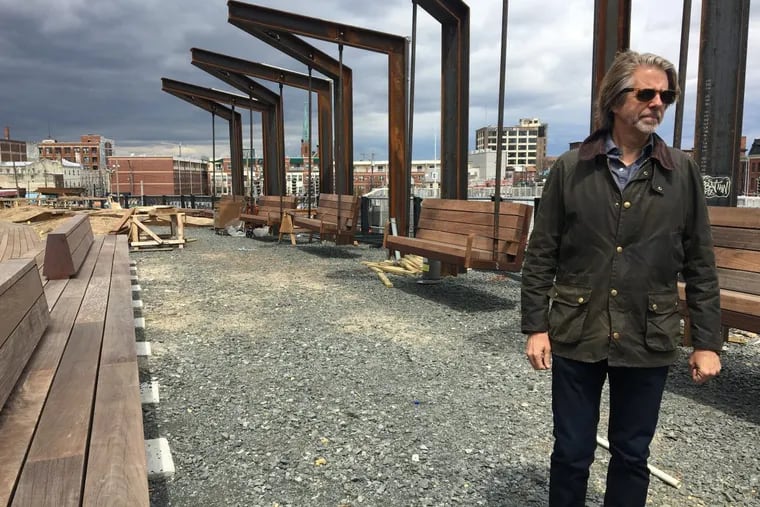 Michael Garden, vice chair of the Friends of the Rail Park, checks on the progress of the park’s first section, which begins at North Broad Street.