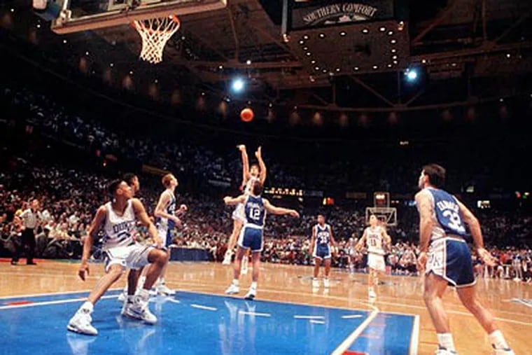 Christian Laettner's buzzer-beating shot for Duke against Kentucky in the 1992 NCAA Tournament at the Spectrum is one of the most famous moments in college basketball history. (Inquirer file photo)
