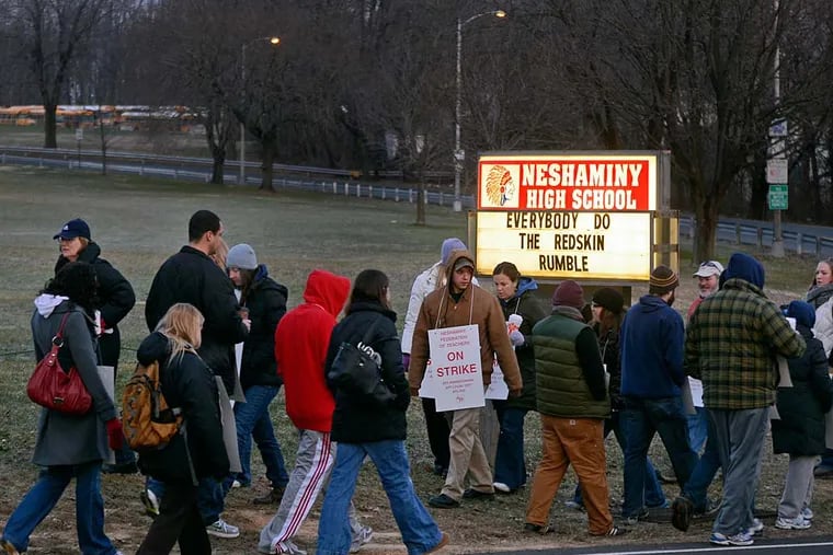 Neshaminy teachers picket outside Neshaminy High School in early morning January 9, 2012.