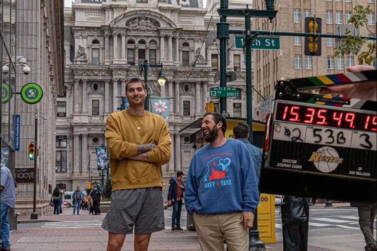 Juancho Hernangomez and Adam Sandler in front of City Hall while filming Netflix's "Hustle."