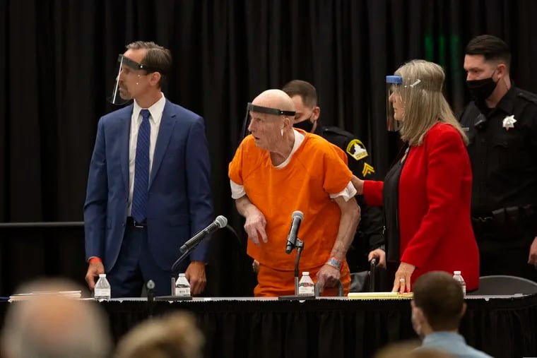 Joseph James DeAngelo, center, charged with being the Golden State Killer, his helped up by his attorney, Diane Howard, as Sacramento Superior Court Judge Michael Bowman enters the courtroom.