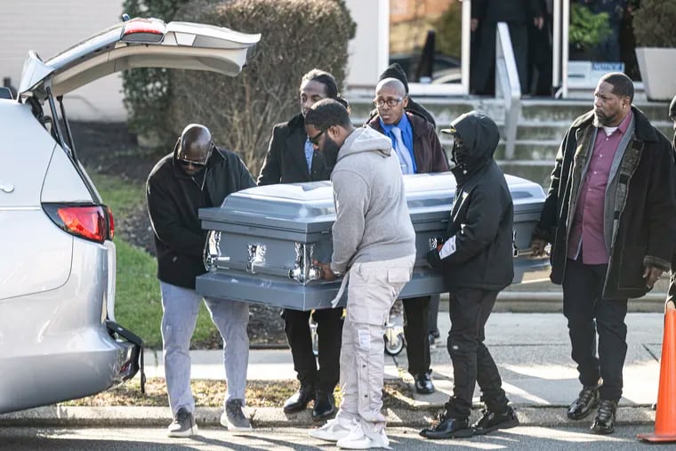 Pallbearers carry the casket of Eric Harrison,  during his funeral on Thursday, Dec 14, 2023 at the True Light Fellowship Church in Philadelphia, Pa. Harrison was the Macy's security guard killed in a double stabbing at the department store early this month.
