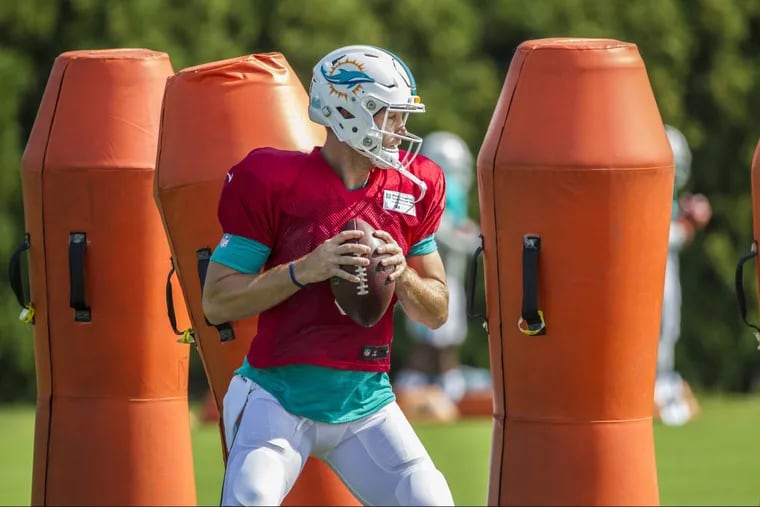 Dolphin quarterback Jay Cutler, #6, weaves his way through large tackling dummies during a quarterback drill prior to the teams combined pracitce with the Philadelphia Eagles on Monday August 21, 2017. MICHAEL BRYANT / Staff Photographer
