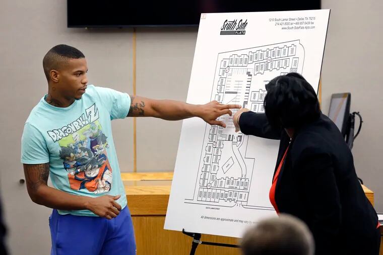 In this Tuesday, Sept. 24, 2019, photo, victim Botham Jean's neighbor Joshua Brown, left, answers questions from Assistant District Attorney LaQuita Long, right, while pointing to a map of the South Side Flats where he lives, while testifying during the murder trial of former Dallas Police Officer Amber Guyger, in Dallas. Authorities say that Brown was killed in a shooting Friday, Oct. 4. (Tom Fox/The Dallas Morning News via AP, Pool)