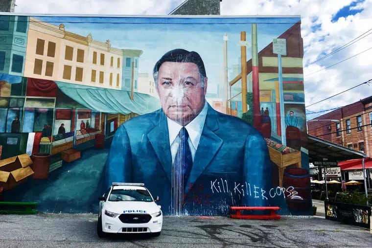 The Frank Rizzo mural after it was vandalized.