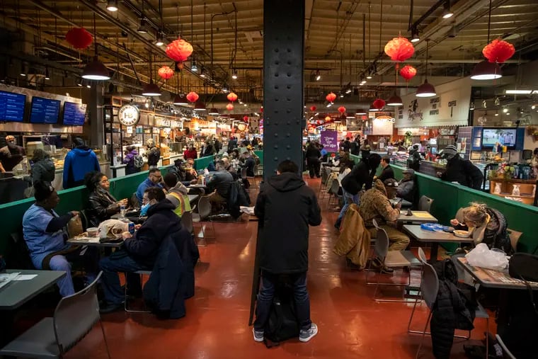 Diners at Reading Terminal Market. On Tuesday, market staff were checking vaccination cards for anyone who wanted to dine in the seating area.