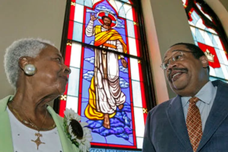At the Society for Helping Church , the Rev. Repsie Warren talks with the Rev. James McJunkin Jr. of the Philadelphia Baptist Association, which has aided the church in its ministry to the deaf.