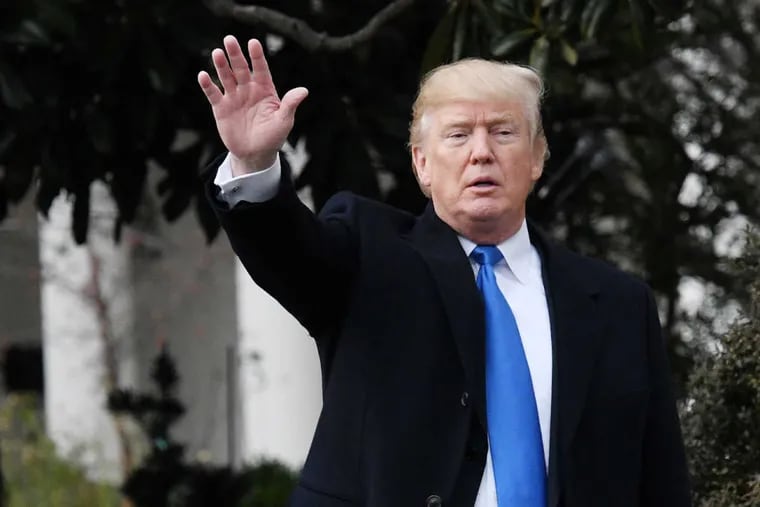 U.S. President Donald Trump waves to guests at the conclusion of an event to celebrate passage of the Tax Cuts and Jobs Act on Wednesday, Dec. 20, 2017 on the South Lawn of the White House in Washington, D.C. (Olivier Douliery/Abaca Press/TNS)