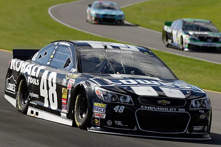 Jimmie Johnson (48) qualifies for Sunday's NASCAR Sprint Cup Series auto race at Pocono Raceway on Friday, June 6, 2014, in Long Pond, Pa. (Mike Groll/AP)