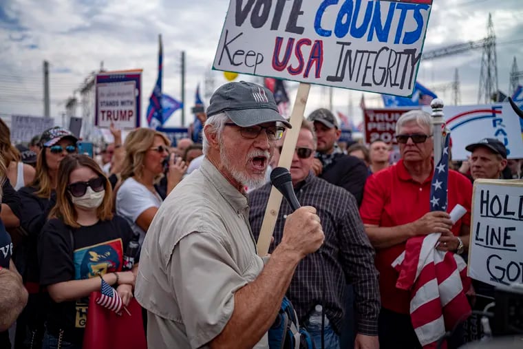 Supporters of President Donald Trump protest in front of the Maricopa County Election Department while votes are being counted in Phoenix on November 6, 2020.