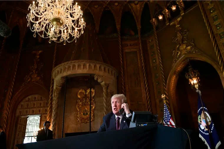 President Trump talks with troops via teleconference from his Mar-a-Lago estate in Palm Beach, Fla., Thursday, Nov. 22, 2018.