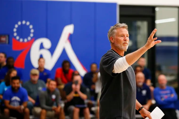 Sixers coach Brett Brown speaks to coaches while hosting his fifth annual clinic at the team's training facility in Camden.