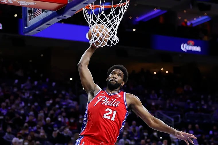 Sixers center Joel Embiid rising to dunk the basketball against the Houston Rockets on Jan. 3 in Philadelphia.