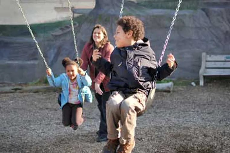 Makai Mastroianni, 7, enjoys the swings with his sister Marissa, 4, and his mother Christina, Tuesday, March 22, 2011, Philadelphia, Pa.
(Maria Pouchnikova / staff photographer)