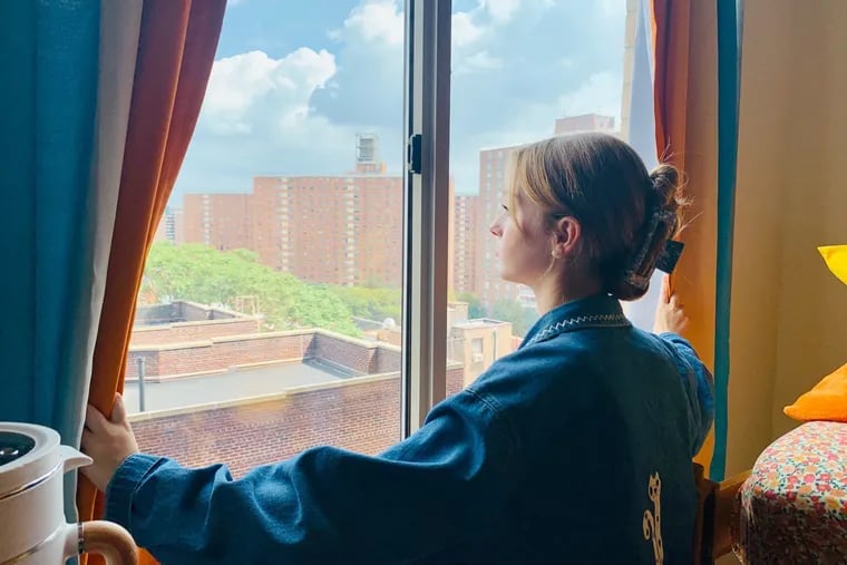 Kate Jones, 18, of Lambertville, N.J., looks out upon New York City from her dorm room at the Manhattan School of Music, where she's a freshman.