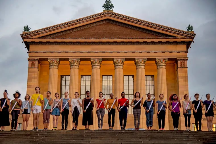 Dancers rehearse their performance, "Bury Our Weapons, Not Our Bodies!" at the William M. Reilly Memorial, behind the West Entrance of the Philadelphia Museum of Art September 19, 2018.