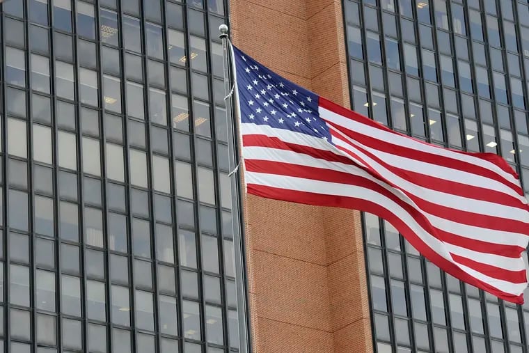 The American flag waves at the James A. Byrne United States Courthouse, Tuesday, Nov. 3, 2020, in Philadelphia.