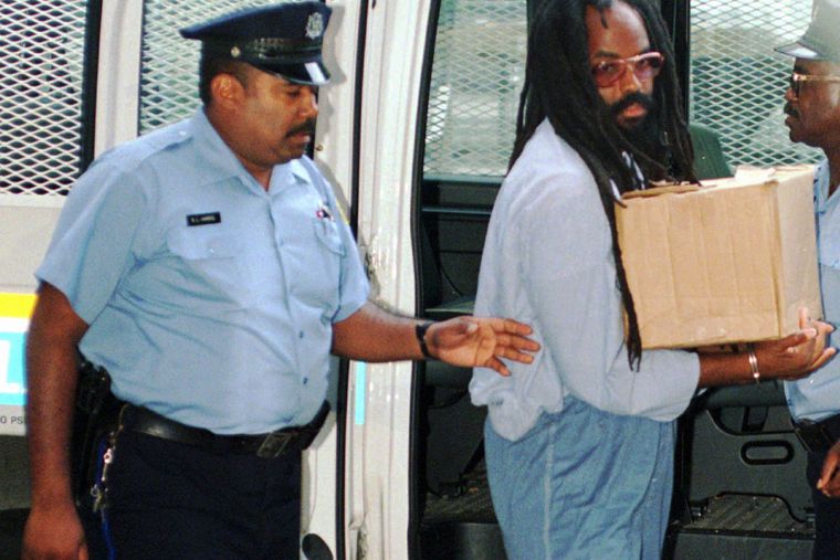 In this 1995 file photo, Mumia Abu-Jamal, convicted of killing a policeman, arrives at Philadelphia's City Hall.