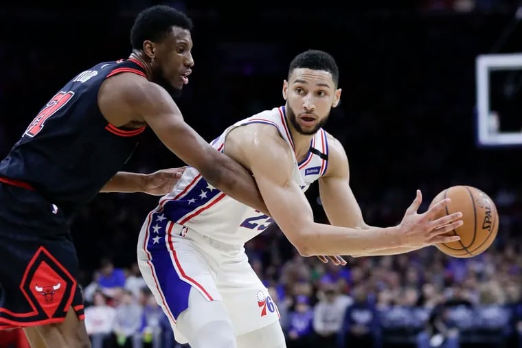 Sixers guard Ben Simmons holds the basketball against Chicago Bulls forward Thaddeus Young on Sunday, February 9, 2020 in Philadelphia.