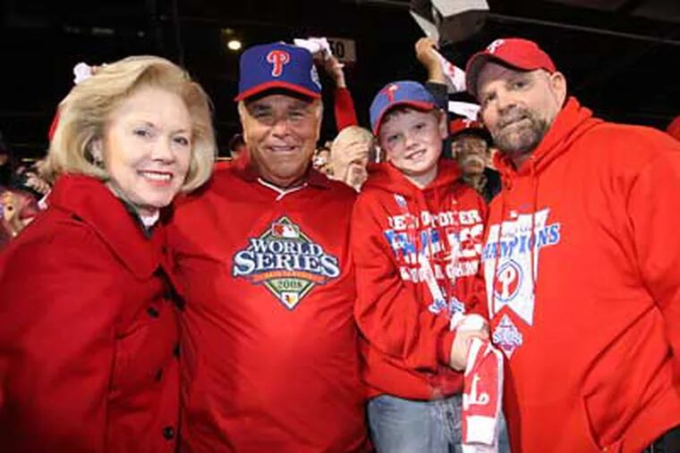 Jake Lancianese, 10, attends Game 4 of the World Series with Gov. Ed Rendell (second from left) and Midge Rendell (left) and his father, Pat Lancianese.  (Steven Falk / Staff Photographer)