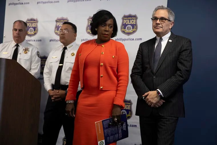 Mayor Cherelle L. Parker stands next to District Attorney Larry Krasner during a news conference Monday regarding the Burholme shooting that injured eight teenagers at a bus stop last week.