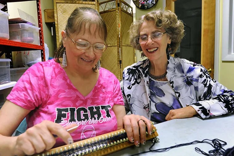 At Jubili Beads & Yarns in Collingswood, owner Judith Weinstein (right) helps Patti Linthicum with a project, on Oct. 10, 2013.  Weinstein not only sells beads and craft supplies, but teaches classes but teaches to special-needs customers.( APRIL SAUL / Staff )