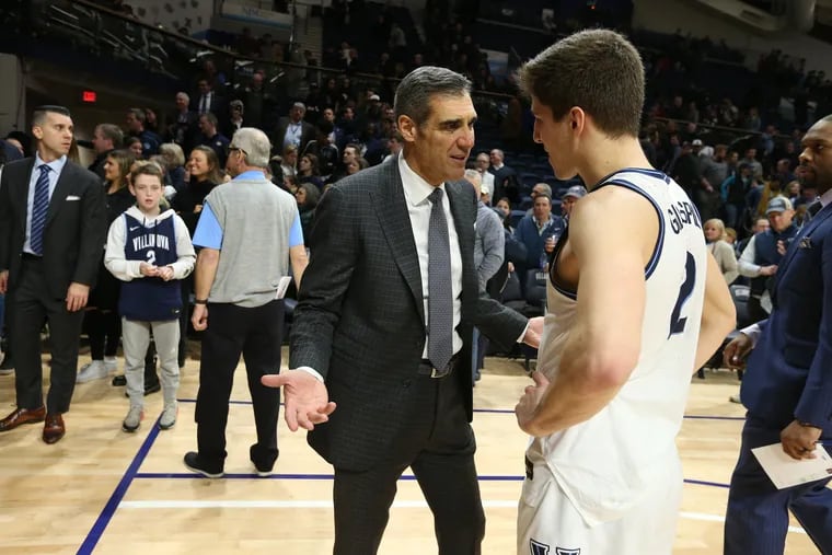 Villanova coach Jay Wright, left, talking with Collin Gillespie after the Wildcats' win over Marquette last Wednesday.