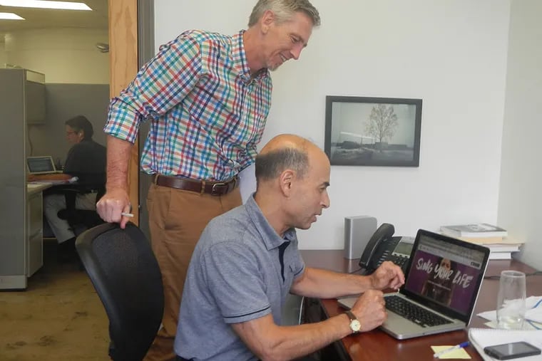 MuseAmi chief operating officer Ed Hynes (left) and CEO and founder Bob Taub in Taub's Princeton office, with a page from the new Hook'd app on the laptop. (Photo by Jeff Gelles)