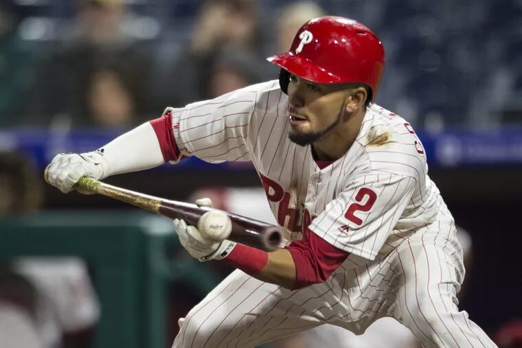 J.P. Crawford bunting for the Phillies during the 12th inning Wednesday night vs. the Reds.