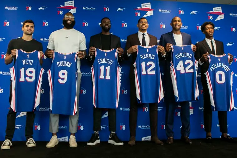 Raul Neto, Kyle O'Quinn, James Ennis, Tobias Harris, Al Horford, and Josh Richardson with their Sixers jerseys after an introductory news conference in  July 2019.