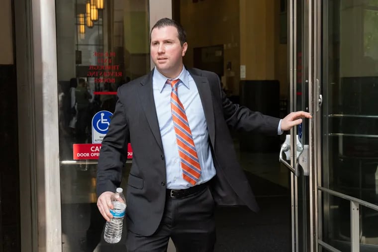 In this file photo, former Philadelphia Police Officer Ryan Pownall exits Juanita Kidd Stout Center for Criminal Justice in Center City, Philadelphia, on Tuesday, Aug. 6, 2019.