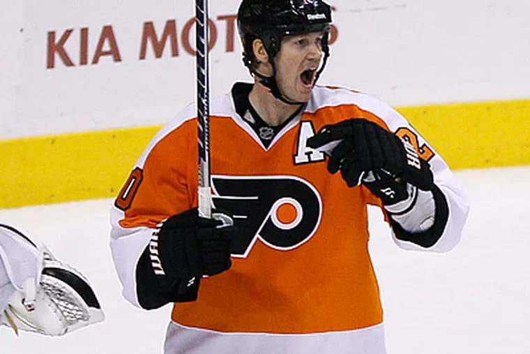 Chris Pronger reacts after being called for a penalty during overtime against the Flames. (AP Photo/Matt Slocum)