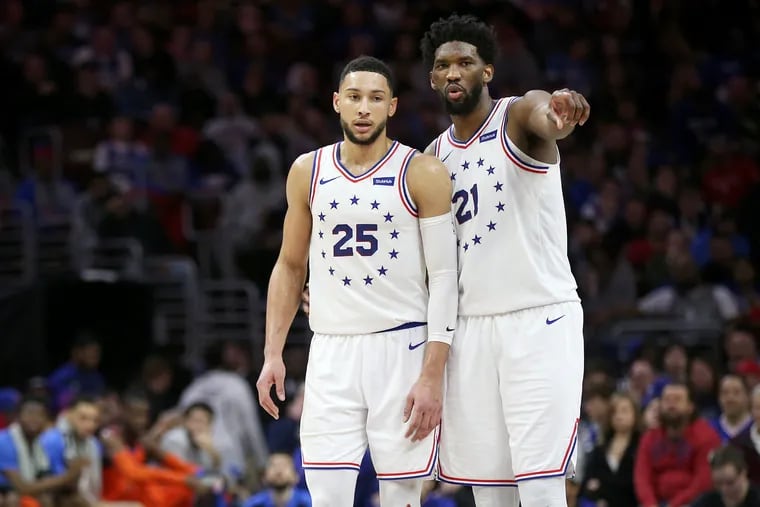 The Sixers' Ben Simmons (25) talking with teammate Joel Embiid during a game against the Oklahoma City Thunder on Jan. 19, 2019.