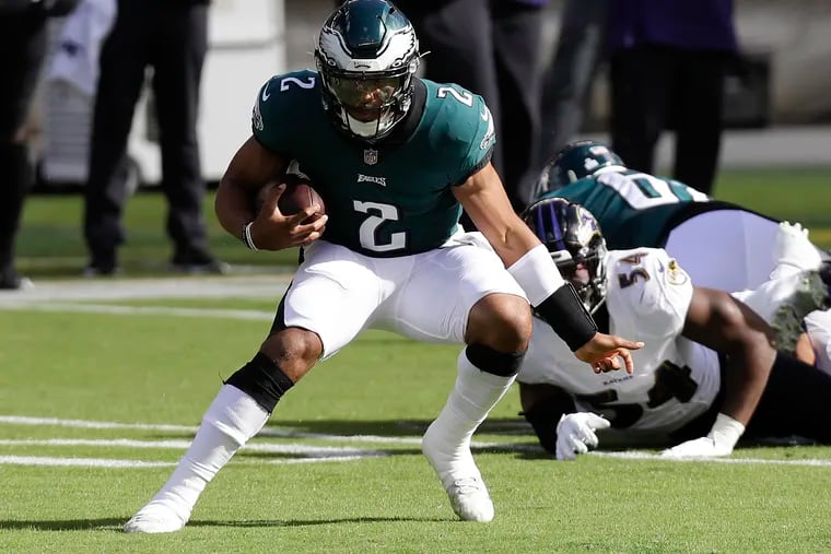 Eagles quarterback Jalen Hurts ripped off a 20-yard gain on his first carry Sunday against the Ravens.