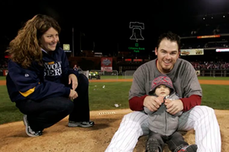 Chad Durbin celebrates the World Series victory with wife Crystal and son Cade.