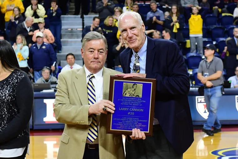 Larry Cannon (right) receives an award from La Salle athletic director Bill Bradshaw.