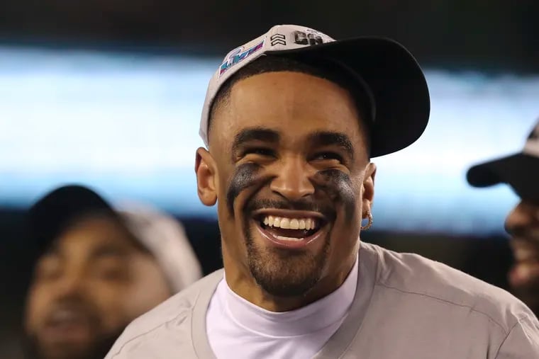 Philadelphia Eagles quarterback Jalen Hurts smiles as he sings the fight song after winning the NFC Championship game against the San Francisco 49ers at Lincoln Financial Field in January.