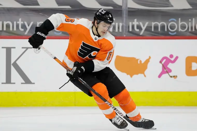 Flyers defenseman Travis Sanheim skates with the puck against the New Jersey Devils during a May game.
