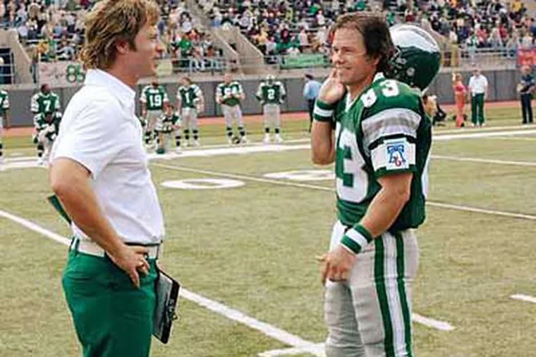 Greg Kinnear as Dick Vermeil and Mark Wahlberg as Vince Papale in "Invincible."