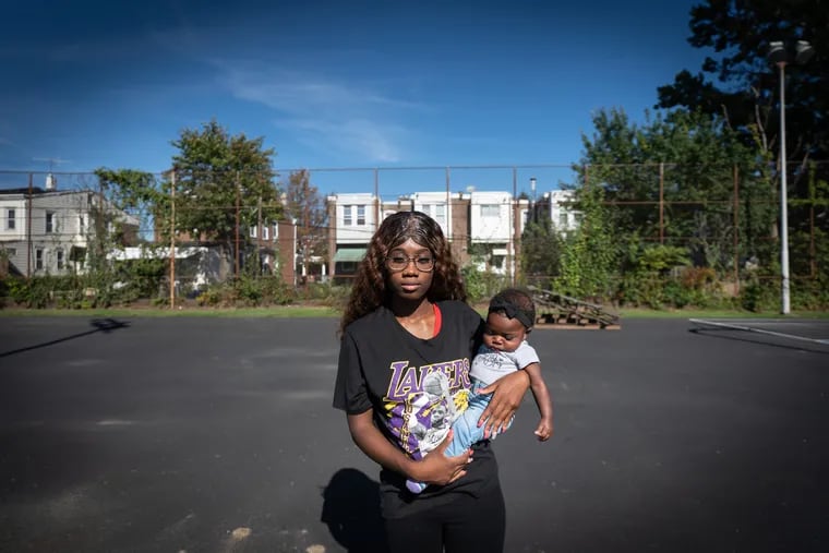 Kymirah Brown and her daughter Journee Sawyer, shown here in Philadelphia, Thursday, Oct. 6, 2022. Brown was formerly in foster care; she now has a family of her own.