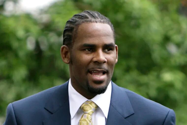 FILE - This June 13, 2008 file photo shows R&B singer R. Kelly, arriving at 3the Cook County Criminal Court Building in Chicago. Attorney Michael Avenatti says he has new video evidence of singer R. Kelly having sex with an underage girl. Avenatti said Thursday, Feb. 14, 2019, he has turned over the video to prosecutors in Chicago. Avenatti says the video is not the same evidence used in Kelly's 2008 trial, when he was acquitted on all charges of child pornography.