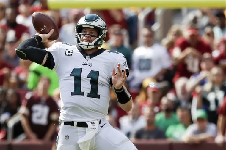 Eagles quarterback Carson Wentz passed for 307 yards and two touchdowns against the Redskins. He was picked off once.