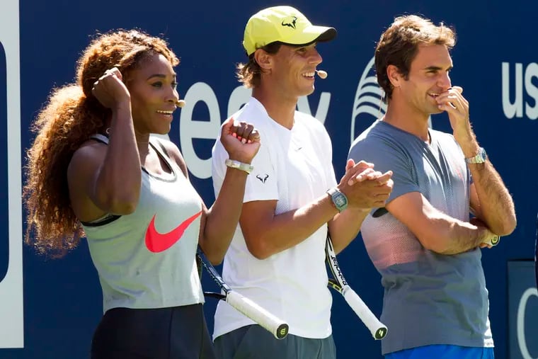 Serena Williams, Rafael Nadal and Roger Federer, right, cheer on the competition during Arthur Ashe Kids' Day, the kick off to the U.S. Open tennis tournament, Aug. 24, 2013, in New York.